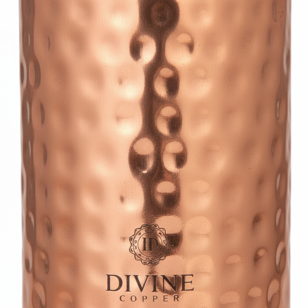 Copper tumbler with a textured surface and 'Divine Copper' branding.