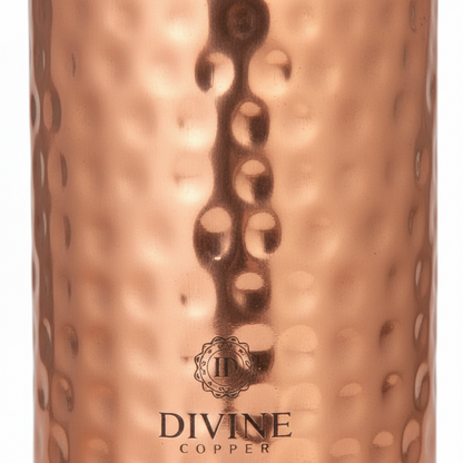Copper tumbler with a textured surface and 'Divine Copper' branding.