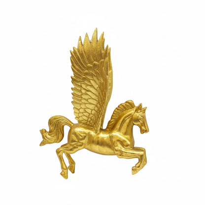 Gold pegasus figurine on a white background