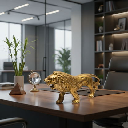 Gold lion statue on a desk in an office setting with a plant and crystal ball.