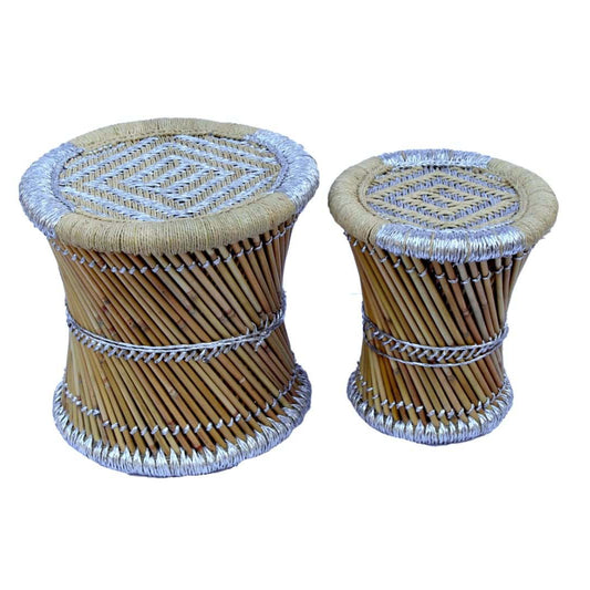 Two small woven stools with a white background