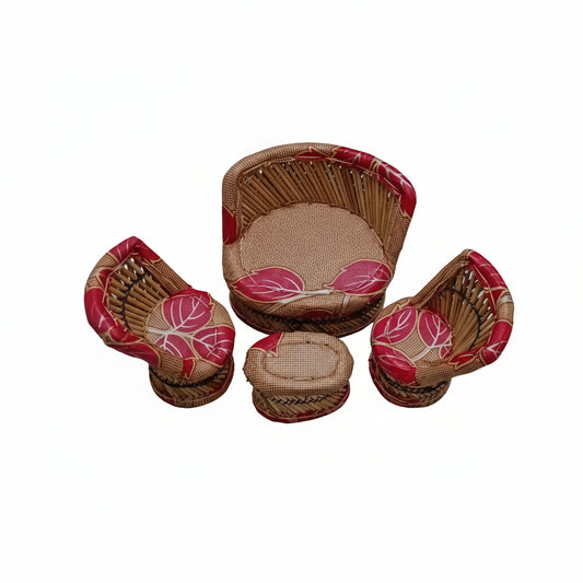 Set of small woven baskets with red and pink leaf patterns on a marble surface