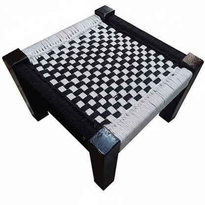 Woven chair with black and white pattern on a white background