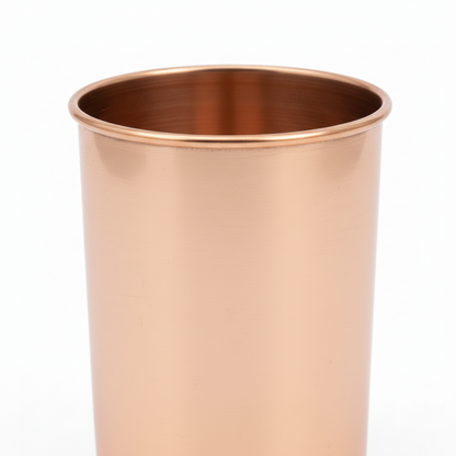 Two copper cups on a white background