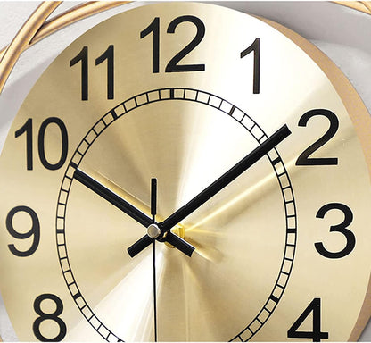 Gold clock face with black numbers and hands on a white background