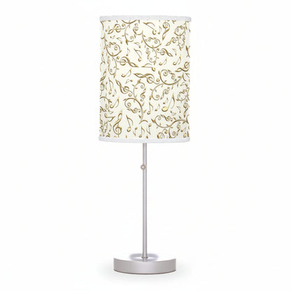 Table lamp with decorative white shade on a white background