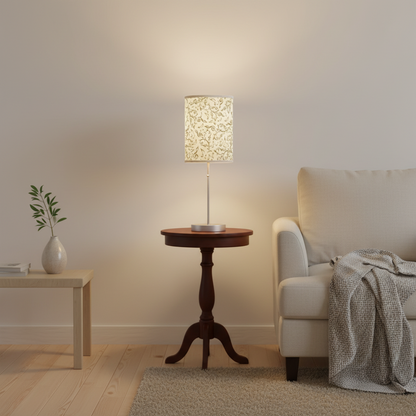 Table lamp with decorative white shade on a white background