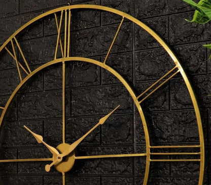 Gold clock on a black brick wall