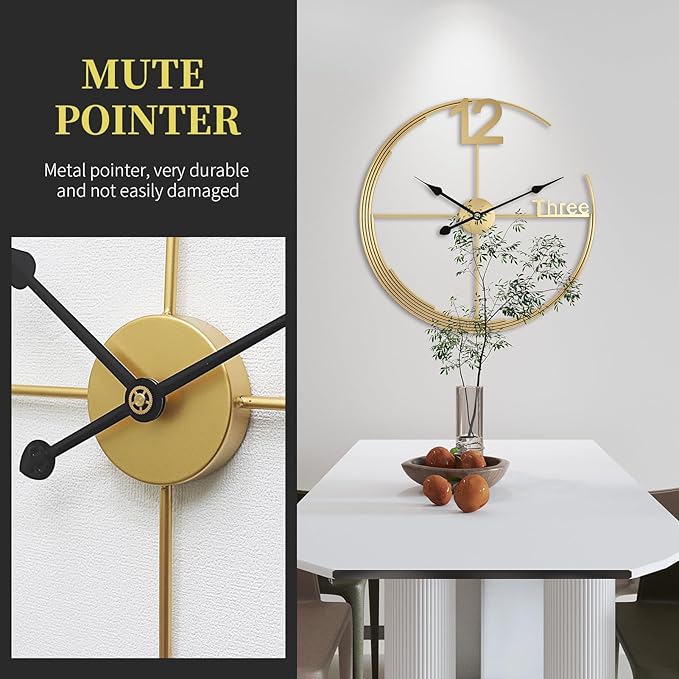 Gold wall clock with black hands on a white wall, next to a table with decorative items.
