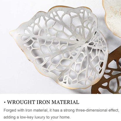 Decorative leaf-shaped object with intricate cut-out design on a white background