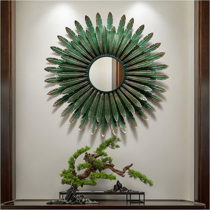 Decorative wall mirror with green leaf-like design on a neutral wall.