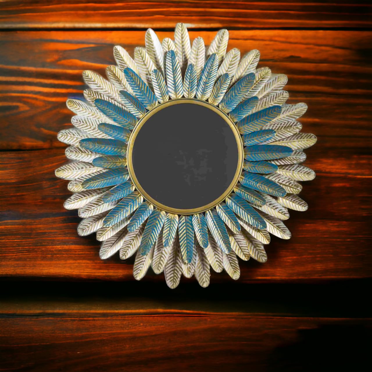 Decorative mirror with sunflower design on a wooden surface