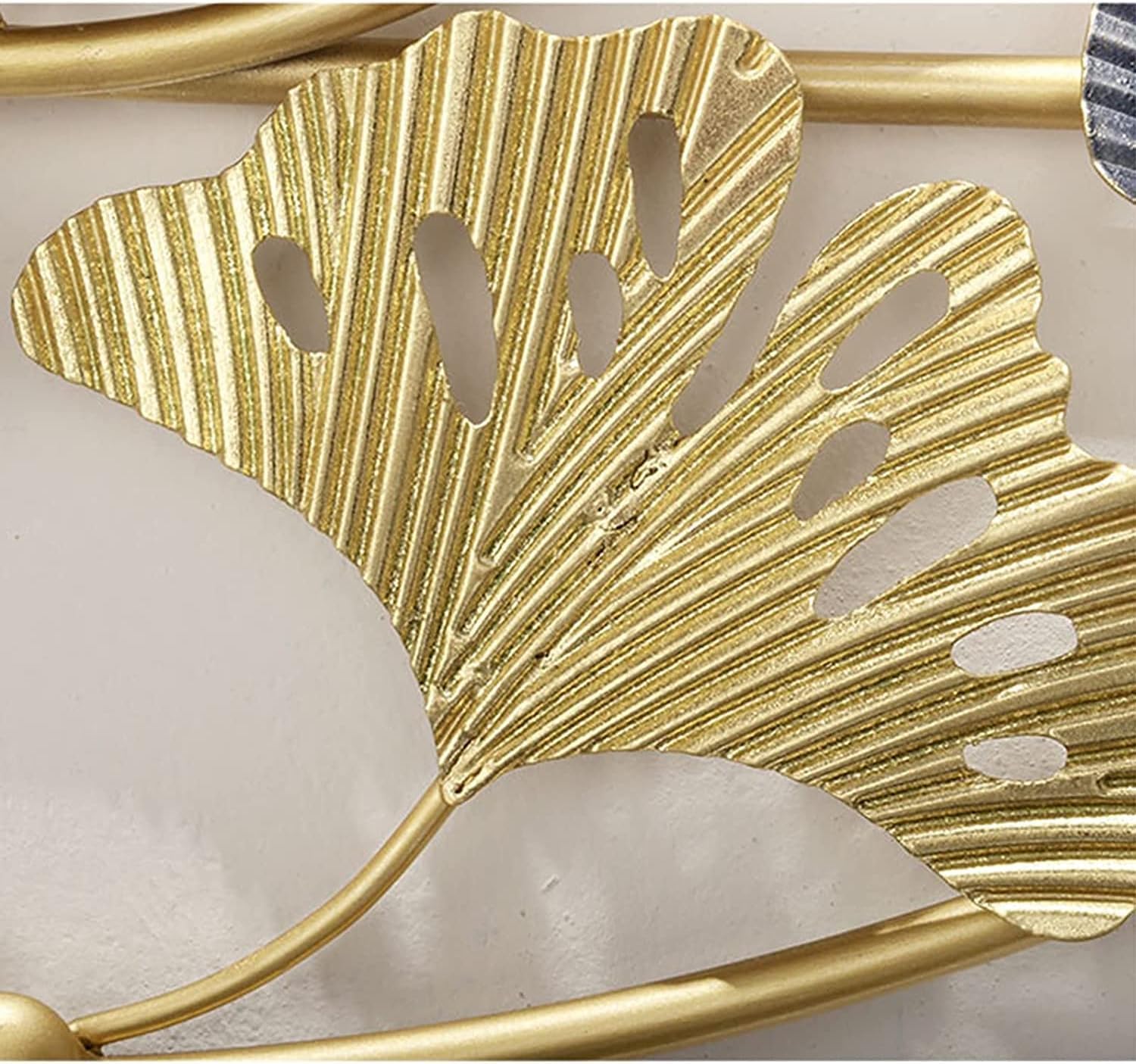 Gold leaf decorative item on a white background