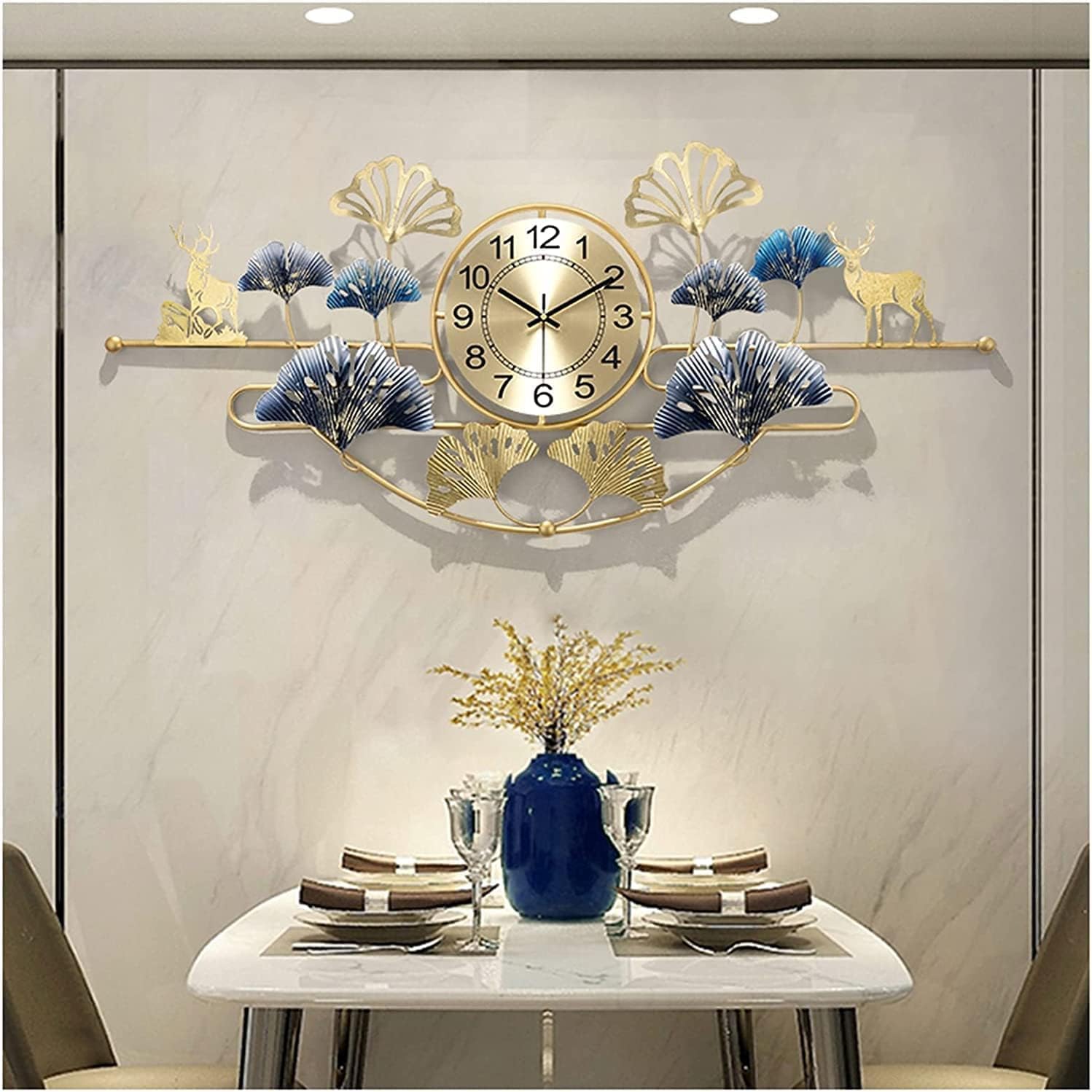 Decorative wall clock with peacock feathers and deer designs above a dining table.