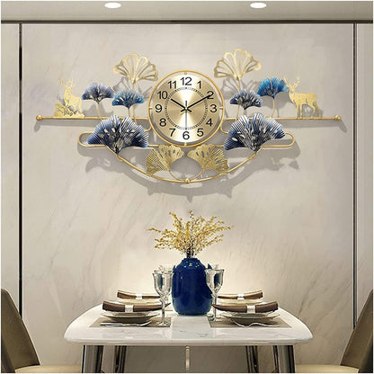 Decorative wall clock with peacock feathers and deer designs above a dining table.