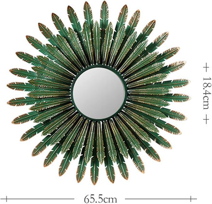 Decorative sunburst mirror with green leaf-like design on a white background
