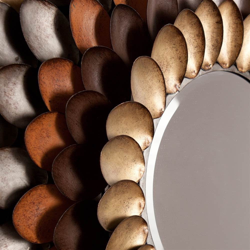 Round mirror with a decorative border of brown and beige stones