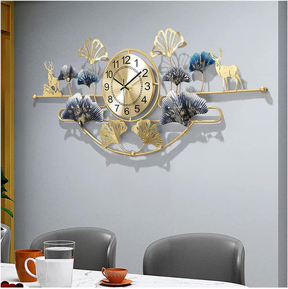 Decorative wall clock with animal and leaf designs on a gray wall above a dining table.