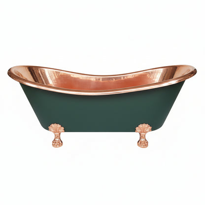 Copper-trimmed bathtub with black interior on a concrete floor.