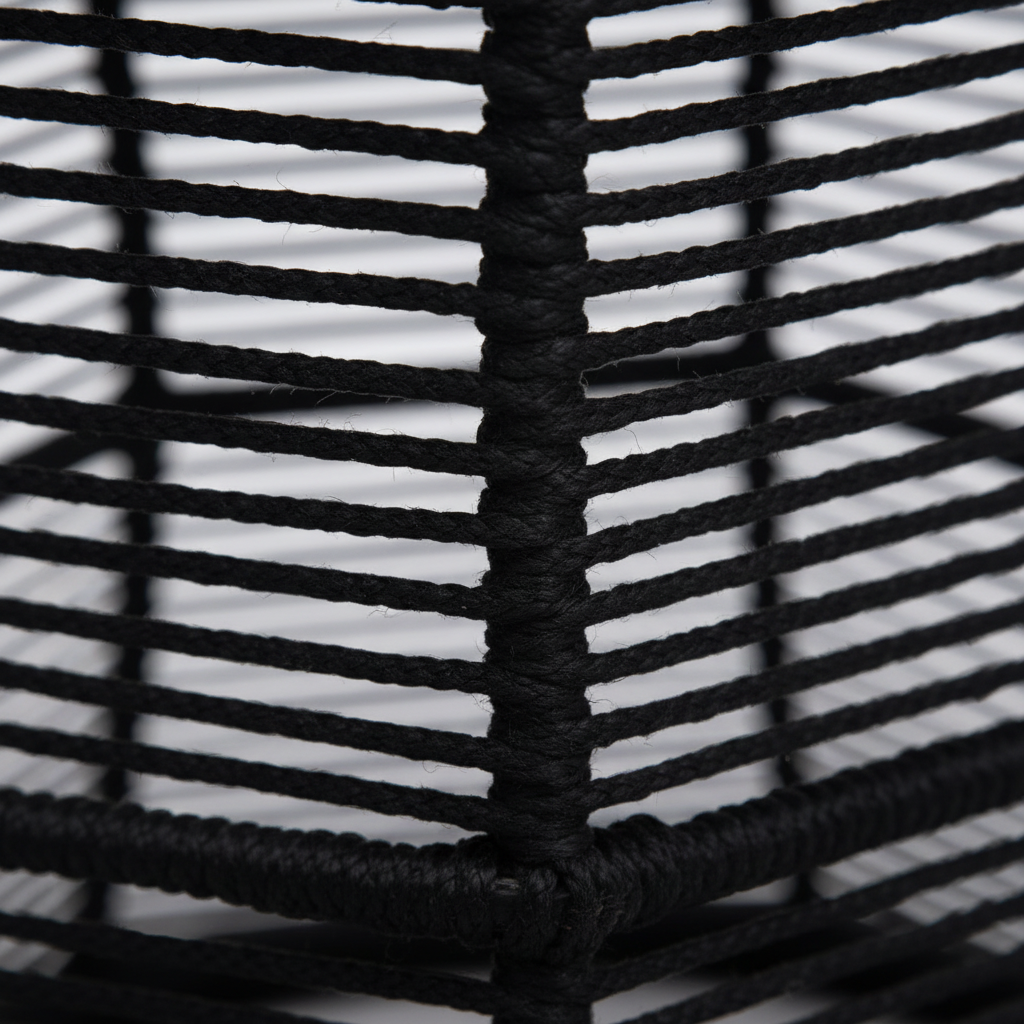 Close-up of black woven basket with white interior