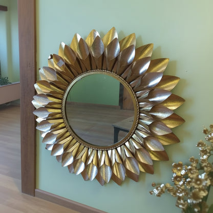 Gold sunburst mirror on a wall