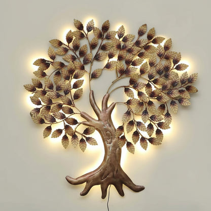Decorative wall art of a tree with illuminated leaves on a light gray background