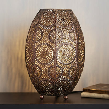 Decorative lamp with intricate patterns on a table