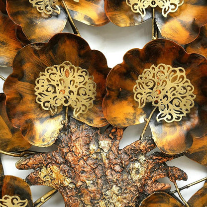 Gold floral earrings on a tortoiseshell background