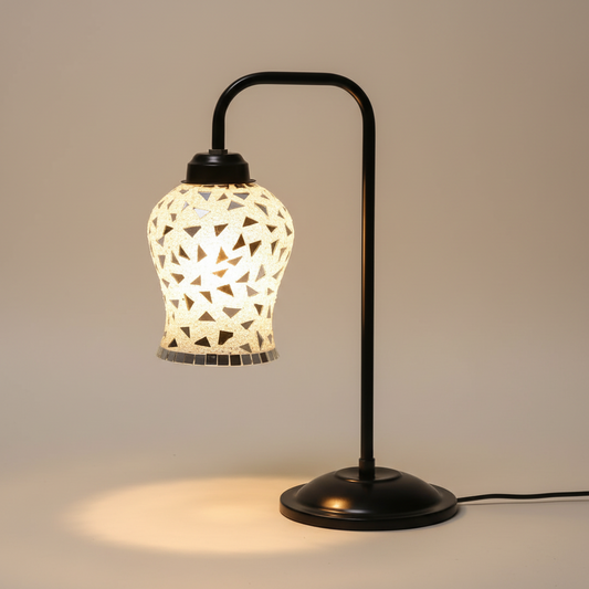 Decorative table lamp with geometric patterned shade on a neutral background