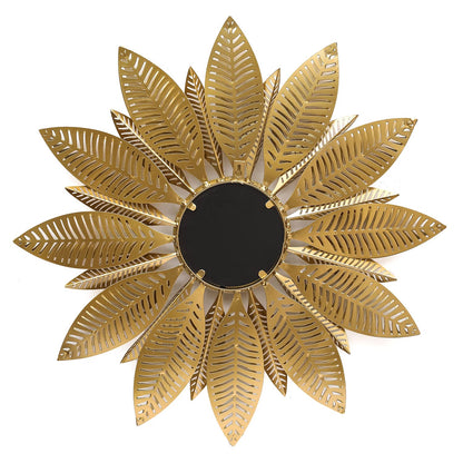 Gold sunflower-shaped decorative mirror on a white background