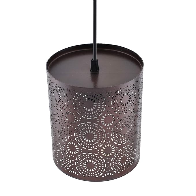 Decorative metal lantern with intricate cut-out design on a white background