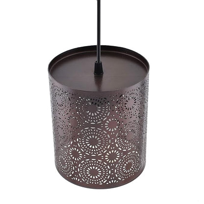 Decorative metal lantern with intricate cut-out design on a white background