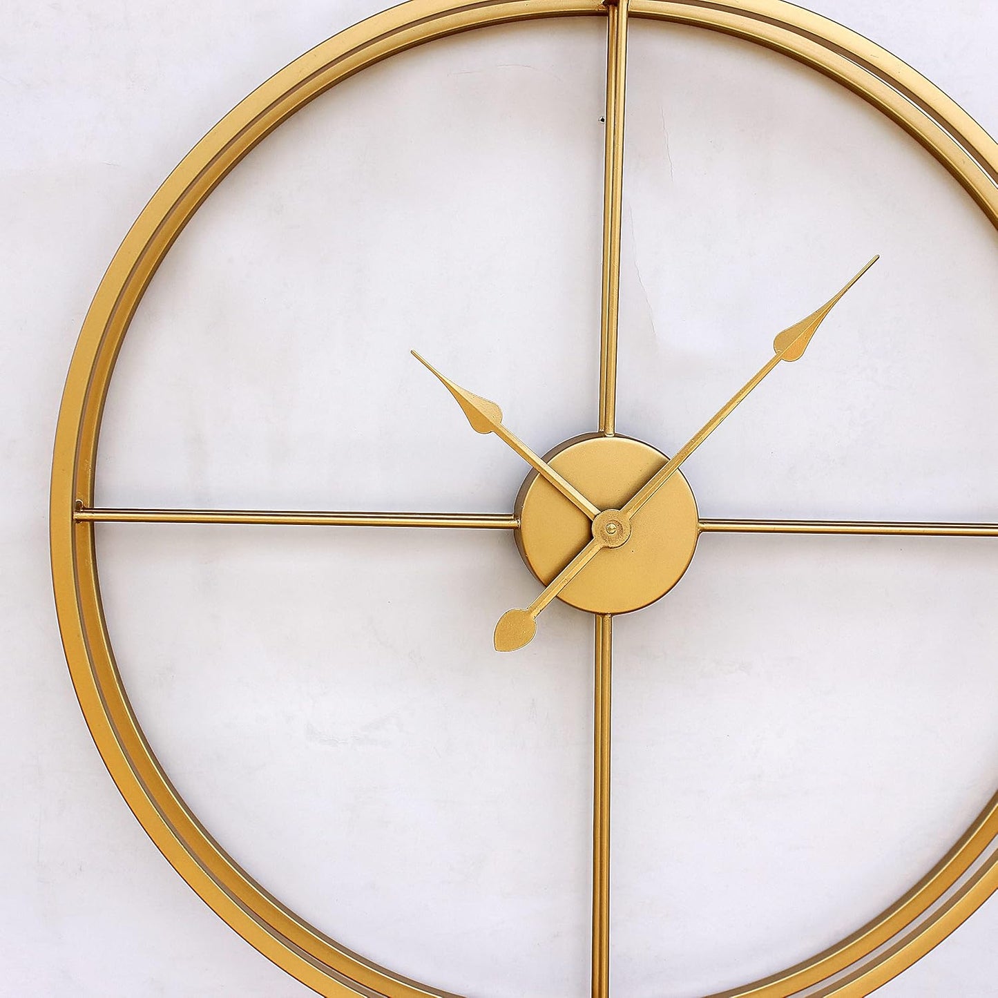 Gold wall clock on a white background