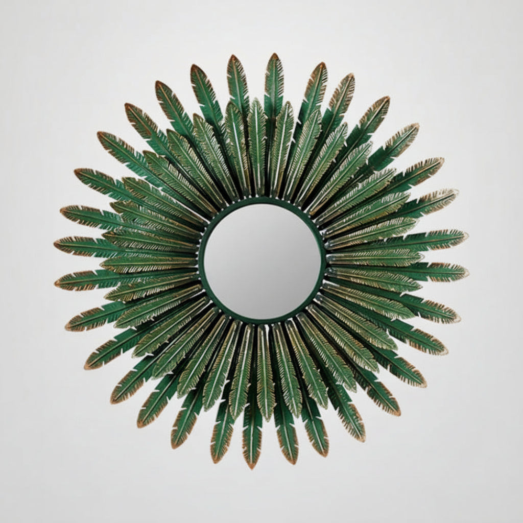 Decorative mirror with green leaf-like design on a white background