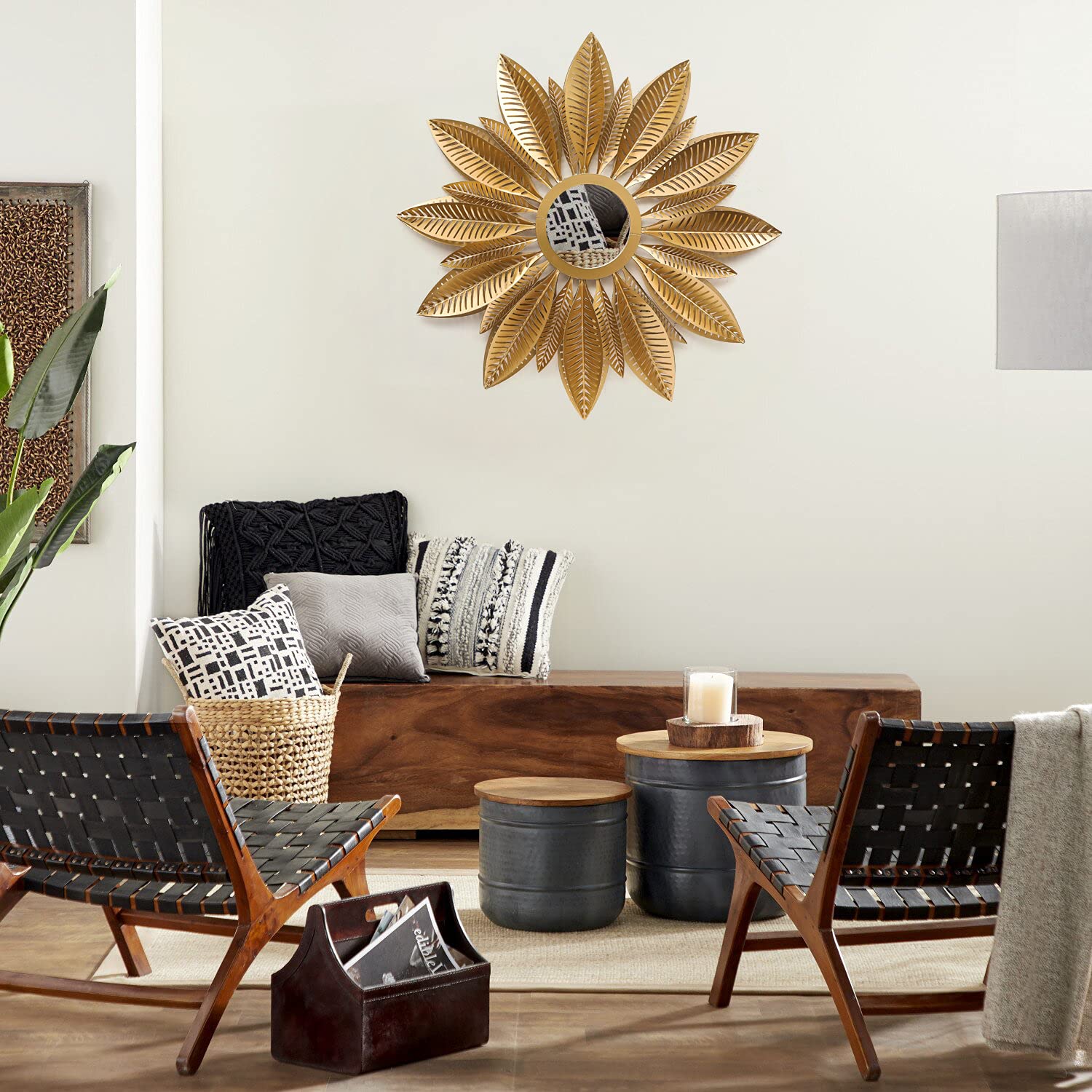 Living room with decorative wall mirror, chairs, and a coffee table.