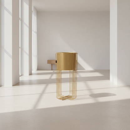 Gold side table in a minimalistic room with sunlight streaming through windows.