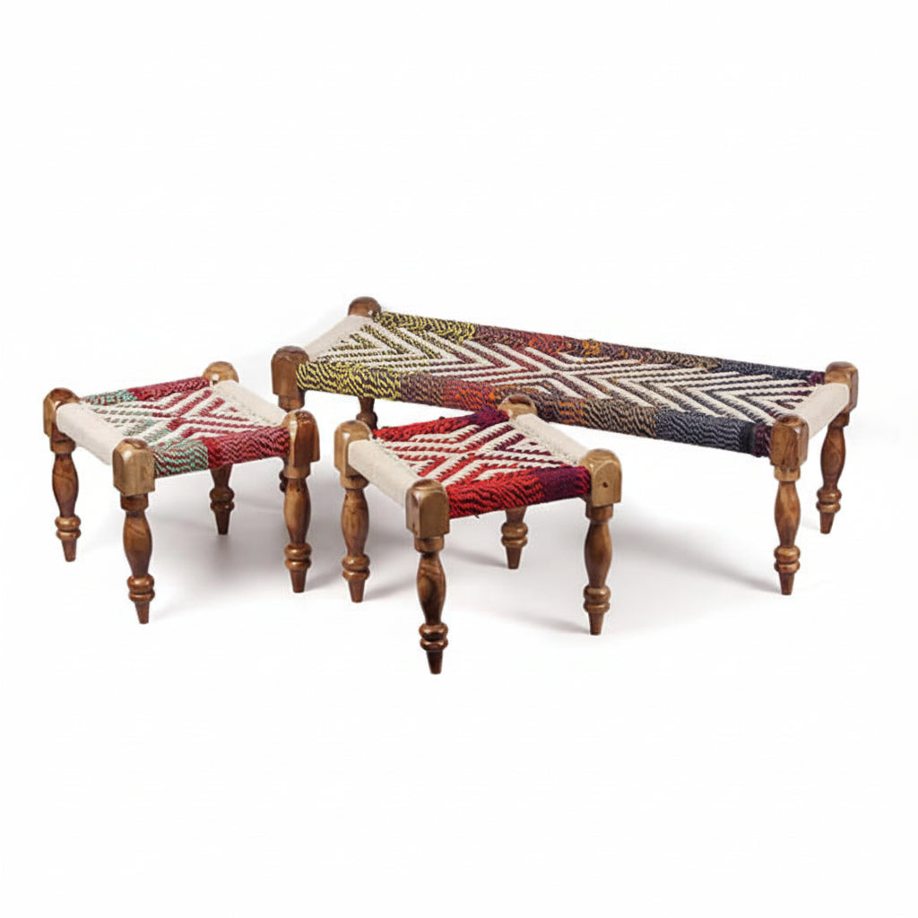 Set of three wooden stools with woven seat covers on a white background