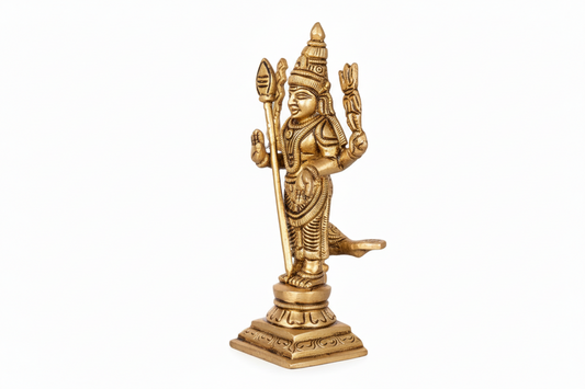 Gold-colored statue of a deity on a white background