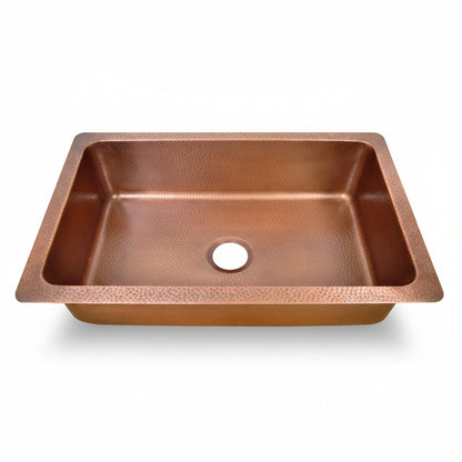 Copper kitchen sink on a white background