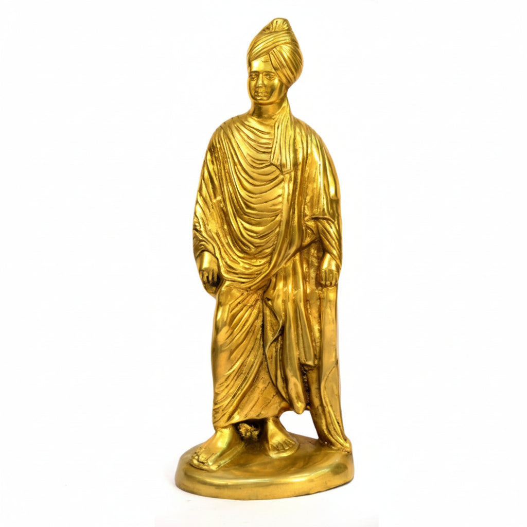 Gold-colored statue of a figure with draped robes and turban on a white background