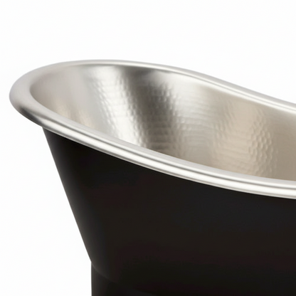 Close-up of a black and silver bathtub with a glossy finish.