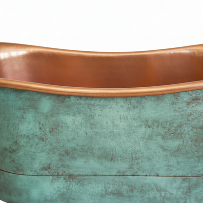 Copper and green metal basin on a white background