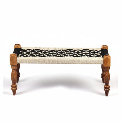 Wooden bench with woven black and beige seat on a white background