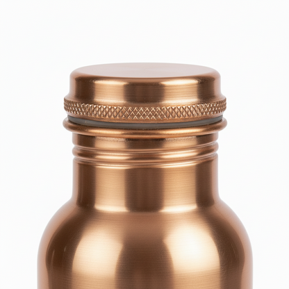 Copper-colored bottle with a lid on a white background