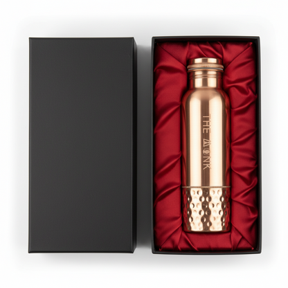 Rose gold water bottle with 'The Avana' branding in a black box with red interior
