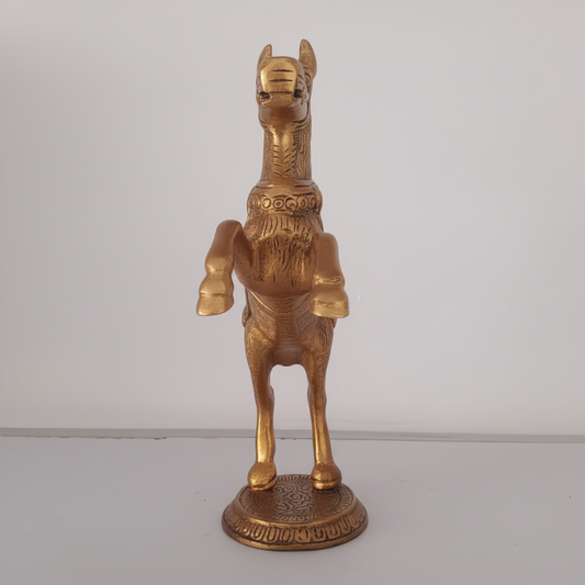 Bronze horse statue on a plain background