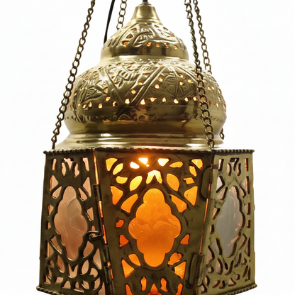Decorative lantern with intricate patterns and a warm glow on a white background