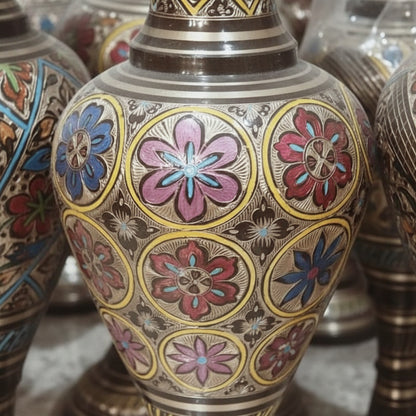 Decorative vase with floral patterns in a store setting