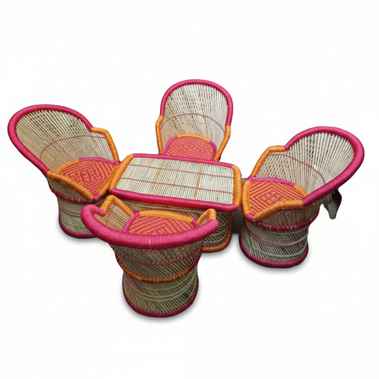 Set of three wicker chairs with pink accents on a white background