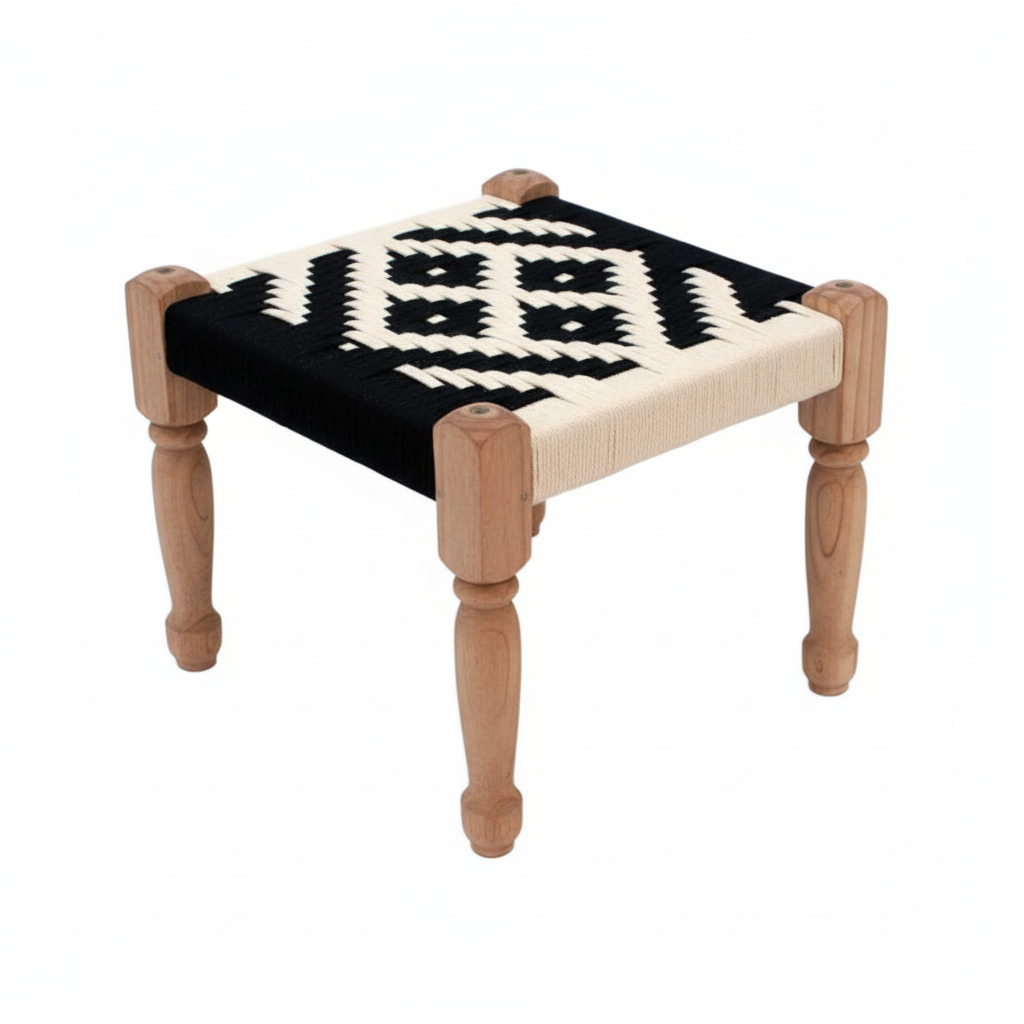 Small stool with black and white patterned seat on a white background
